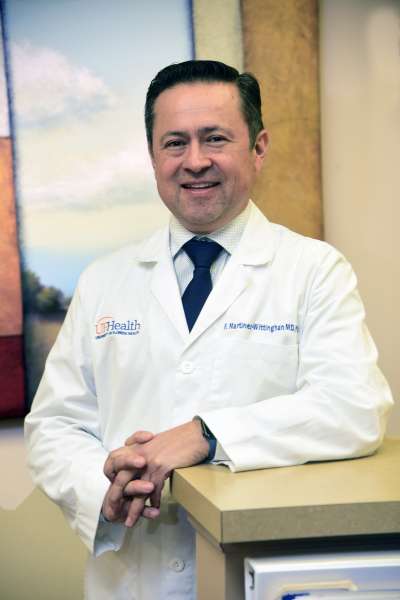 Dr. Martinez-Wittinghan standing in the Augustine Oaks Family Medicine Office